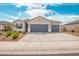 Well-maintained single-Gathering home with a three-car garage and manicured desert landscape at 1021 W Descanso Canyon Dr, Casa Grande, AZ 85122