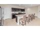 Kitchen area with granite countertops, stainless steel appliances, dark cabinets, and an island with seating at 1021 W Descanso Canyon Dr, Casa Grande, AZ 85122