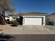 Charming single-story home featuring a two-car garage and a low maintenance front yard at 1030 E Susan Ln, Tempe, AZ 85288