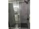 Sleek, updated shower with glass door and gray tile at 1030 E Susan Ln, Tempe, AZ 85288