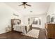 Serene bedroom with wood-look floors and natural light creating a peaceful retreat for rest and relaxation at 10307 W Windsor Blvd, Glendale, AZ 85307