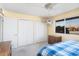 Bright bedroom with a ceiling fan, carpeted floors, and window letting in natural light at 10423 W Monterosa Dr, Sun City, AZ 85351