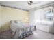 Bedroom featuring a large window, soft carpet, and light colored walls at 10423 W Monterosa Dr, Sun City, AZ 85351