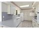 Functional kitchen featuring sleek countertops, modern appliances, and ample cabinet space for storage at 10423 W Monterosa Dr, Sun City, AZ 85351