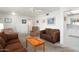 Open-concept living room featuring neutral walls, comfortable seating, and a seamless flow to other areas at 10423 W Monterosa Dr, Sun City, AZ 85351