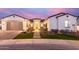 Inviting exterior of home featuring manicured front yard with stone walkway and charming facade at 11143 N Mckinney St, Surprise, AZ 85388