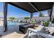 Inviting pool area with a modern pergola-covered lounge and stylish outdoor furniture at 11143 N Mckinney St, Surprise, AZ 85388