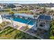 Aerial view of a backyard oasis with a pool, lounge area, and lush green lawn at 11143 N Mckinney St, Surprise, AZ 85388