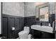 Elegant powder room with custom wallpaper, modern fixtures, and stylish design at 11143 N Mckinney St, Surprise, AZ 85388