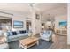 Bright living room with vaulted ceilings, light wood floors, and stylish coastal-inspired decor at 1157 W Edgewater Dr, Gilbert, AZ 85233