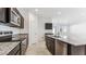 Modern kitchen with an island, granite countertops, and stainless steel appliances at 11875 E Aster Ln, Florence, AZ 85132