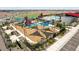 Aerial view of the community playground with colorful play structures, swings, and shaded seating at 11875 E Aster Ln, Florence, AZ 85132