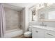 Updated bathroom with stylish tile, marble countertop, and decorative mirror at 13234 W Desert Glen Dr, Sun City West, AZ 85375