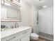 Bright bathroom featuring a glass enclosed shower with modern finishes at 13234 W Desert Glen Dr, Sun City West, AZ 85375