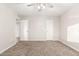 Bedroom with carpet, ceiling fan, and multiple doors at 13234 W Desert Glen Dr, Sun City West, AZ 85375