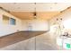 Spacious garage with concrete floor, window, and door at 13234 W Desert Glen Dr, Sun City West, AZ 85375