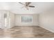 Open living room with tile floors, natural light, and colorful stained glass at 13234 W Desert Glen Dr, Sun City West, AZ 85375