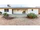 Covered patio with a view of the desert landscaped backyard for shaded outdoor entertaining, complete with lighting at 13234 W Desert Glen Dr, Sun City West, AZ 85375