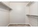 Spacious walk-in closet with shelving, carpet, and white walls at 13234 W Desert Glen Dr, Sun City West, AZ 85375