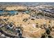 A lovely aerial view of the community's park area with a large pond, picnic areas, and recreation at 1353 N Avoca --, Mesa, AZ 85207