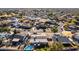 Aerial view of a single Gathering home in a residential area with an inground pool and playground at 1353 N Avoca --, Mesa, AZ 85207