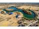 Stunning aerial view of a community lake with walking paths, covered seating and recreation areas at 1353 N Avoca --, Mesa, AZ 85207