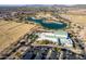 Aerial shot of the community, featuring its large recreation center, green spaces, and a large pond area at 1353 N Avoca --, Mesa, AZ 85207