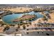 Aerial view of a lake with a paved parking lot, walking trail and picnic structure nearby at 1353 N Avoca --, Mesa, AZ 85207