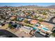 Aerial view of a single Gathering home in a residential area with mountain views in the background at 1353 N Avoca --, Mesa, AZ 85207