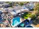 Aerial view of a private backyard with a pool, green lawn, playground, seating area, and fenced perimeter at 1353 N Avoca --, Mesa, AZ 85207