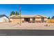 Charming single-story home with desert landscaping and inviting front porch seating at 1353 N Avoca --, Mesa, AZ 85207