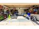 Organized two-car garage filled with storage solutions and recreational equipment, maximizing space and functionality at 1353 N Avoca --, Mesa, AZ 85207