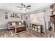 Relaxing living room with a comfortable sofa, decorative rug, and a stone fireplace, offering a cozy atmosphere at 1353 N Avoca --, Mesa, AZ 85207