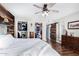 Primary bedroom featuring wood floors, a ceiling fan and walk in closets at 1353 N Avoca --, Mesa, AZ 85207