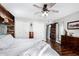 Primary bedroom featuring wood floors, a ceiling fan and walk in closets at 1353 N Avoca --, Mesa, AZ 85207