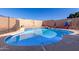 Backyard pool features a baja shelf, pebble tec finish, and refreshing water at 1353 N Avoca --, Mesa, AZ 85207