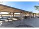 Large covered ramada in the community park with picnic tables for residents' enjoyment at 1353 N Avoca --, Mesa, AZ 85207