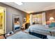 Bedroom featuring a sky light, sliding glass doors, and a full length mirror at 13633 N 111Th Ave, Sun City, AZ 85351