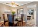 Cozy dining room with a glass-top table, seating for four, and elegant decor at 13633 N 111Th Ave, Sun City, AZ 85351