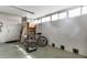 Spacious garage with ample storage space, featuring a bicycle, shelving units, and bright lighting at 13633 N 111Th Ave, Sun City, AZ 85351