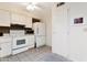 Functional kitchen with white cabinets, essential appliances, and plenty of storage at 13633 N 111Th Ave, Sun City, AZ 85351