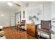 Comfortable sun room with wooden floors, sliding glass doors, ceiling fan and decorative mirror and woodwork at 13633 N 111Th Ave, Sun City, AZ 85351