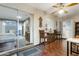 Relaxing sun room with natural light, a ceiling fan, access to patio through sliding glass door, and access to other rooms at 13633 N 111Th Ave, Sun City, AZ 85351