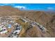 Expansive aerial shot of a residential community nestled among desert hills and mountain ranges at 14543 N Adero Canyon Dr, Fountain Hills, AZ 85268