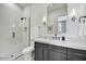 Modern bathroom featuring a glass enclosed shower and a floating vanity with sleek fixtures at 14543 N Adero Canyon Dr, Fountain Hills, AZ 85268