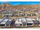 Picturesque aerial view of a modern community with mountain views, highlighting the architecture and outdoor living spaces at 14543 N Adero Canyon Dr, Fountain Hills, AZ 85268