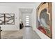 Bright foyer featuring tile flooring, modern art, and a sleek console table that enhances the home's contemporary design at 14543 N Adero Canyon Dr, Fountain Hills, AZ 85268