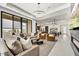 Inviting living area showcasing an open layout with contemporary furnishings, seamlessly connected to the kitchen and dining spaces at 14543 N Adero Canyon Dr, Fountain Hills, AZ 85268