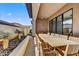 An expansive dining area with a long wooden table sits under a covered patio with desert landscaping at 14543 N Adero Canyon Dr, Fountain Hills, AZ 85268