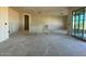 Spacious living room with large sliding glass doors offers tons of natural light at 15752 W Beryl Ave, Waddell, AZ 85355